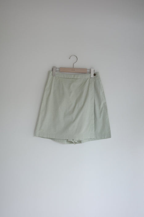 Pale green shorts